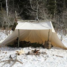 a tent is set up in the snow