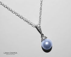 Wedding Swarovski 8mm Light Blue Pearl Drop Pendant with .925 Sterling Silver Chain Bridal Necklace. CHAIN is 18 inches (45.7cm) long. PENDANT is about 0.75 inch (2cm) long including bail. Elegant and timeless, this dainty necklace is perfect for weddings or special occasions such as birthdays, anniversaries, graduations, proms...or whatever you can imagine! Handmade necklace, is with .925 Sterling Silver 18 inches cable chain, Swarovski 8mm Light Blue round crystal pearl, Rhodium Sterling Silve Elegant Light Blue Necklace For Anniversary, Elegant Light Blue Round Pendant Necklace, Elegant Light Blue Jewelry For Gift, Blue Pearl Pendant Jewelry, Blue Pendant Jewelry With Pearl, Blue Pearl Pendant Jewelry For Wedding, Formal Blue Necklace With Pearl Pendant, Elegant Light Blue Necklace For Wedding, Elegant Light Blue Wedding Necklaces