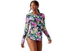 Tommy Bahama Coastal Gardens Rashguard - Women's Swimwear : Black : Give your beachside look a fun update by opting for the Tommy Bahama Coastal Gardens Rashguard. Crew neckline and long sleeves with thumbholes. Tropical floral print throughout. Curved hemline. UPF 50+ sun protection. Pull-on construction. 73% nylon, 27% Lycra spandex. Hand wash, line dry. Imported. If you're not fully satisfied with your purchase, you are welcome to return any unworn and unwashed items with tags intact and orig Upf 50+ Long Sleeve Rash Guard For Beach Season, Long Sleeve Floral Print Stretch Swimwear, Long Sleeve Swimwear Upf 50+ For Summer, Printed Rash Guard For Beach, Summer Beach Rash Guard With Thumbholes, Long Sleeve Floral Print Swimwear For Surfing, Beachwear Rash Guard With Upf 50+ Long Sleeve, Long Sleeve Rash Guard With Upf 50+ For Beachwear, Spring Long Sleeve Rash Guard With Uv Protection