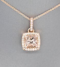 "Handcrafted Morganite and Diamond Halo 14k Rose Gold Pendant Necklace, Wedding Necklace, Bridesmaid Gift, Blush Pink Rose Gold, Gift for Her This sparkling handmade pendant necklace looks gorgeous in its rose gold setting, perfect for any occasion. The piece features a 2.70ct cushion Morganite as the main stone, which has a halo of 0.37ctw diamonds framing it. All stones are prong set in 14k rose gold, with small diamond accents on the gallery. The bale is locked in place so the pendant does no Delicate Rose Gold Jewelry With Halo Setting, Classic Rose Gold Necklace For Wedding, Classic Rose Gold Necklaces For Wedding, Rose Gold Wedding Jewelry With Diamond Accents, Fine Jewelry Cushion Cut For Wedding, Delicate Halo Setting Wedding Jewelry, Elegant Rose Gold Morganite Jewelry, Pink Cushion Cut Wedding Jewelry, Pink Cushion Cut Jewelry For Wedding