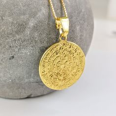 A gold disc of Phaestos charm necklace on a k14 solid gold chain. The ancient Greek calendar has hieroglyphics on both sides, in the form of a spiral, that have not yet been deciphered by archaeologists. K14 gold is used for the pendant and for the chain. A meaningful gift for a lover of historical artefacts. The actual disc is displayed in the museum of Herakleion on the Greek island of Crete. The gold necklace is delivered in a gift box. FREE  SHIPPING: Free international shipping with Fedex International Priority or DHL Express. Please provide a mobile phone number for delivery updates from shipping company. Carrier and tracking code are messaged to buyer once shipment is complete. All jewelry is shipped from our premises in Athens, Greece. GIFT WRAPPING: All jewelry is delivered in an Engraved 14k Gold Amulet Medallion Necklace, Symbolic Gold-plated Coin Necklace, Symbolic Engraved Yellow Gold Medallion Necklace, Spiritual Engraved Yellow Gold Medallion Necklace, Engraved Yellow Gold Spiritual Medallion Necklace, Symbolic Yellow Gold Coin Pendant Necklace, Symbolic Yellow Gold Coin Necklace, 14k Stamped Amulet Style Round Pendant Necklace, Engraved 14k Gold Amulet Coin Necklace