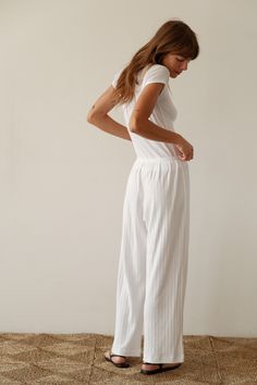 Our best-selling simple pant reimagined in a cropped silhouette. The Pointelle Simple Crop Pant is super-soft, effortless and versatile. Pairs perfectly with The Pointelle Sqaure Neck Tank and The Pointelle Baby Tee Made in LA Relaxed Fit Wide-leg Pants For Daywear, Cropped Summer Bottoms For Daywear, Fitted Cotton Wide Leg Pants For Daywear, High-waisted Wide Leg Pants With Elastic Waistband, Spring Cropped Pants With Relaxed Fit, White Cropped Bottoms For Daywear, Chic Cropped Bottoms For Daywear, Stretch Wide Leg Pants For Daywear, Daywear Wide-leg Pants With Elastic Waistband