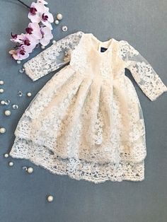 Ivory organic cotton lining and ivory gorgeous lace baby girl's christening/ baptism/flower girl gown.  3 pearl buttons closure at the back. Two-layered lace skirt, looks gorgeous when cascades while holding the baby.  Please contact the shop owner regarding any specific measurements or inquiries.  Matching bonnet - https://www.etsy.com/ca/listing/558391374/ivory-christening-bonnet-ivory-lacy Matching headband - https://www.etsy.com/ca/listing/577338309/baby-girl-headband-lace-headband-infant Ma Outfit For Wedding, Blessing Gown, Girls Baptism Dress, Flower Girl Gown, Blessing Dress, Beautiful Lace Dresses, Baptism Gown, Christening Gown