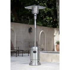 an outdoor patio heater sitting on the ground