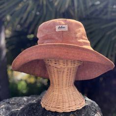 "A wide brim sun hat for beach days and summer fun.  This sun hat for women has a nice wide brim to protect your whole face and even your neck and chest.  This hat folds up so it is easy to bring along in your bag.   This hat is made from a medium weight homespun linen and cotton blend fabric in a rust color.  Inside liner is white cotton.  I used a stiff interfacing for brim to keep it's shape. A sun hat for beach days and summer fun.  This sun hat for women has a nice wide brim to protect your Cheap Adjustable Wide Brim Bucket Hat, Summer Bucket Hat With Flat Brim For Travel, Summer Travel Bucket Hat With Flat Brim, Adjustable Short Brim Bucket Hat For Sunbathing, Wide Brim Sun Hat For Beach Season Sunbathing, Brown Uv Protection Bucket Hat, Brimmed Bucket Hat For Beach Season Sunbathing, One Size Sun Hat With Short Brim For Sunbathing, Brimmed Bucket Hat For Sunbathing And Beach Season