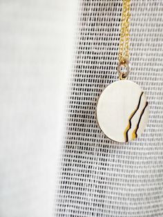 Embrace the timeless beauty of Kintsugi with our handmade small round pendant necklace. Inspired by the ancient Japanese art of mending broken ceramics with precious metals, this pendant combines delicate silver and gold elements in a dainty, minimalistic design. A perfect accessory for both men and women, it symbolizes the beauty found in imperfections and the art of embracing life's scars. You can discover the KINTSUGI COLLECTION here: https://www.etsy.com/shop/GlafxJewelry?ref=seller-platform Nature-inspired Round Necklaces For Jewelry Making, Handmade Elegant Round Medallion Necklace, Elegant Handmade Round Medallion Necklace, Minimalist Engraved Round Medallion Necklace, Minimalist Necklace With Large Medallion Pendant, Unique Necklaces With Coin Pendant, Unique Coin Pendant Necklace, Minimalist Round Locket Jewelry, Unique Round Coin Pendant Necklace