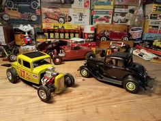 several toy cars and trucks on a wooden table