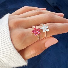 The stunning Dahlia flower is a symbol of elegance, creativity, and wealth. For centuries, this beautiful bloom has been used to express admiration and love.Keep this stunning ring close to remind yourself to love freely and always follow your heart. Rose gold plated, copper AAA cubic zirconia crystal Adjustable ring size - one size fits all Hypoallergenic, lead & nickel free If you aren't in LOVE with your purchase, please let us know within 30 days of receiving your item, and you'll receive a stress-free refund. Dainty Pink Gold Flower Jewelry, Red Flower-shaped Gemstone Jewelry, Delicate Flower Shaped Pink Gold Jewelry, Delicate Pink Gold Flower Jewelry, Pink Gold Flower Shaped Jewelry Gift, Pink Gold Flower-shaped Jewelry Gift, Rose Gold Flower Ring For Promise, Rose Gold Flower Promise Ring, Pink Gold Flower Jewelry For Gifts