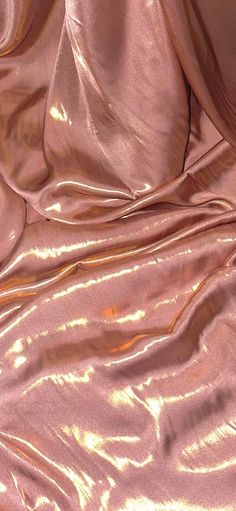 Our shimmer satin has a superior drape like no other. This luxurious fabric has a soft touch and glows beautifully creating a perfect blend between the shimmer and satin. Perfect for all types of dressmaking, crafting, decorating and various other projects.  *Colours may vary due to different screens.  *Width 58 inches *Synthetic *Machine Washable *If you order more than 1 meter, fabric will come as one continuous length. *Fast Delivery Before you go please check out our other items. We offer co Golden Pink Aesthetic, Pink Royalty Aesthetic, Gold And Pink Aesthetic, Pink Draping, Silk Aesthetic, Feminine Fabric, Satin Curtains, Rose Gold Fabric, Pink Satin Fabric