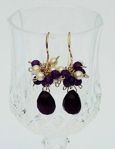 "Dark Purple Chalcedony Teardrop Briolette Pair with Perfect Faceted Cuts and Extremely High Shine dangle and have clustered above them White freshwater Baroque Seed Pearls and Dark Purple Amethyst Faceted Roundels. A best seller. These earrings have classic lines and are perfect for day wear or a special evening out. They would look Elegant while in a gown or dressed Down for a night on the town even a day spent shopping.These Lovely Handmade Pearl Cluster Earrings are large though delicate in Gifts For Sister Birthday, Sister Birthday Gifts, Pearl Cluster Earrings, White Pearl Earrings, Purple Chalcedony, Christmas Gifts For Sister, Gifts For Girlfriend, White Pearl Earring, Pearl Cluster