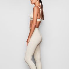 These cotton leggings hug the body yet allow your skin to breathe with cool and comfy natural fibers. The classic, rustic design elevates your lounge look. | SKIMS Legging | White | Cotton Rib Cotton Fitted Activewear For Pilates, Seamless High Stretch Cotton Activewear, Fitted Cotton Activewear For Pilates, Comfortable Leggings For Loungewear, High Stretch Seamless Cotton Activewear, Seamless Casual Loungewear Leggings, Full Length Ribbed Waistband Athleisure Leggings, Full Length Athleisure Leggings With Ribbed Waistband, Casual Compressive Leggings For Loungewear