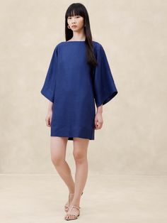 This versatile mini dress is cut with wide sleeves for dramatic effect.  For fabric, we selected a certified European linen—a fabric we love for its lived-in look and its ability to stay cool and crisp in the face of heat and humidity.  Relaxed fit.  Boatneck.  Invisible zip at back.  Lined bodice and skirt, unlined sleeves.  Relaxed fit.  Long sleeves.  Mini length.  Model: Size 2, 5'10" (178cm). Blue Linen Dress, Work Dresses, Linen Mini Dress, Tall Clothing, Women's Sweaters, Womens Fashion For Work, Wide Sleeves, Starry Sky, Linen Dress