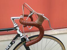 a close up of a bike with a handlebar on the front and back end