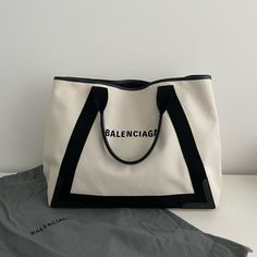 Balenciaga Medium Navy Cabas Canvas Tote Bag. Have Used A Few Times. Show Signs Of Wear. Please See Attached Pictures. In Good Condition. Width: 17” Height: 13” Depth: 8” Designer Canvas Shoulder Bag With Large Capacity, Designer Canvas Bag With Top Handle For Errands, Designer Canvas Shoulder Bag For Shopping, Luxury Large Capacity Canvas Bag For Errands, Luxury Large Capacity Canvas Bag For Shopping, Luxury Large Capacity Canvas Shopping Bag, Designer Canvas Bag With Double Handle For Errands, Designer Double Handle Canvas Bag For Errands, Designer Canvas Bag For Daily Use