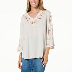 Colleen Lopez Embroidered Woven Tunic  Pretty floral embroidery details this lightweight tunic, an elegantly easygoing look that elevates casual outfits. Casual V-neck Top With Embroidered Sleeves, Casual V-neck Blouse With Embroidered Sleeves, Casual V-neck Blouse With Embroidered Hem, Spring Long Sleeve Top With Embroidered Hem, Beige Floral Embroidery Relaxed Fit Tops, Beige Relaxed Fit Top With Floral Embroidery, Spring V-neck Top With Floral Embroidery, Fall V-neck Top With Embroidered Hem, Spring Floral Embroidery V-neck Top