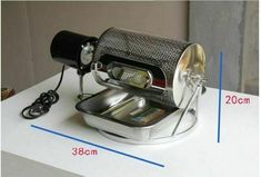 an image of a coffee maker on top of a table with measurements for the machine