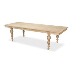 a large wooden table with turned legs