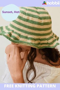 a woman wearing a green and white striped hat with text overlay reading sunset, hat free knitting pattern