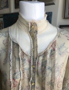 Beautiful Vintage 70s Sheer Floral Cotton Print with Victorian Lace Collar Prairie Blouse with Pearlized buttons down the front and on the gently billowed poet sleevees! I think you would be hard pressed to find another like it! So beautiful and bohemian, and feminine! What a find. I have been holding onto it since i was a teenager, but it's time that someone else should love it. It is in great condition!  ITEM DETAILS AND MEASUREMENTS: TAG SIZE: N/A I would think Petite to Medium depending on Desired Fit LABEL:Peppermill of California Pit to Pit: 19.5" Sleeve Length: 23" Shoulder to Shoulder: 15.5" Armpit opening: 10" Length: 22" Condition: Excellent ITEM DETAILS AND MEASUREMENTS: TAKEN FLAT LABEL: Marchese SIZE TAG: 10 Fabric: 100 % Silk Body, Lining: Silk PIT TO PIT: 16.5" FULL STRAP LE Vintage Blouse For Fall Daywear, Sheer Blouse For Daywear, Vintage Lace Collar Blouse For Summer, Vintage Collar Blouse For Summer, Vintage Blouse With Button Closure For Spring, Spring Vintage Fashion Blouse With Buttons, Vintage White Blouse For Spring, Summer Vintage Blouse With Buttons, Spring Victorian Blouse For Daywear