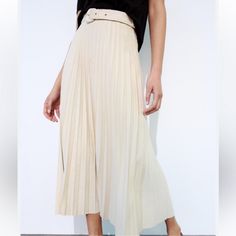 New With Tag Midi Skirt With A High Waist And Tonal Belt. Zip Closure. Outer Shell 100% Polyester Ecru | 3046/031 1058 White Pleated Midi Skirt For Spring, White Midi-length Pleated Skirt For Spring, White Flowy Pleated Midi Skirt, Chic High-waist Pleated Skirt For Summer, Chic High Waist Pleated Skirt For Summer, Spring Belted Skirt Bottoms, Chic Summer Pleated Midi Skirt, Chic Summer Midi Pleated Skirt, Belted Skirt For Spring