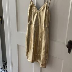 Gold Lam’e Gold V-neck Slip Dress For Spring, Gold Dress For Going Out, Dressy Gold Summer Dress, Gold Dressy Summer Dress, Gold Chic Mini Dress For Spring, Chic Gold Midi Dress For Spring, Chic Gold Mini Dress For Spring, Chic Gold Bodycon Dress For Summer, Gold Spring Mini Dress For Brunch