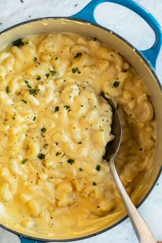 macaroni and cheese in a pot with a spoon