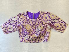 Shop beautiful purple Banarasi saree blouse online in USA. Elevate your saree style with exquisite readymade saree blouses, embroidered saree blouses, Banarasi saree blouse, designer saree blouse, choli-cut blouses, corset blouses from Pure Elegance Indian clothing store in USA.-full view Purple Banarasi Saree, Banarasi Saree Blouse, Designer Saree Blouse, Saree Blouses Online, Indian Clothing Store, Blouse Designer, Corset Blouse, Saree Style, Readymade Saree