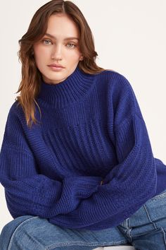 A timeless turtle neck sweater featuring our signature patchwork knit pattern, the VALAIS has a boxy fit and is crafted in a wool nylon blend. With chunky rib knit neck, cuffs and hem. Blue Turtleneck Sweater With Ribbed Cuffs, Blue Funnel Neck Winter Sweater, Winter Blue Turtleneck With High Neck, Blue Funnel Neck Sweater For Winter, Blue Funnel Neck Sweater With Ribbed Cuffs, Blue Turtleneck For Winter Layering, Cozy Blue High Neck Sweater, Blue Knit High Neck Sweater, Blue Chunky Knit Turtleneck Sweater