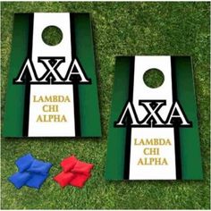 two pieces of cornhole game with the names of each team and colors on it