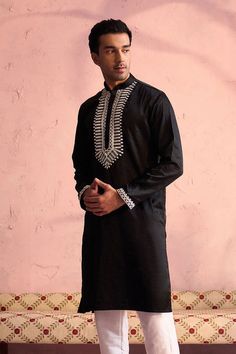 SHRESTHA BY VASTRAMAY Men's Black Silk Machine Embroidered Kurta Elegant and trendy, this black kurta features machine embroidery on the neckline. Made from a silk blend, it has a mandarin collar, long sleeves, and side slits for added comfort. Key Features Black silk blend with machine embroidery Mandarin collar Long sleeves Side slits Specifications Knee length Material & Care Top fabric: Silk blend Dry clean only Legal Disclaimer: The product is guaranteed to be 100% genuine. Product images a Black Kurta, Sleeveless Jacket, Fabric Silk, Full Sleeves, Packaging Labels, Top Fabric, Product Images, Mandarin Collar, Black Silk