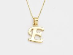 Gold Letter E Pendant made of Gold Vermeil ☞ thickest 18k Gold Plating on top of Solid 925 Sterling Silver ☞ made to last.  Full Letters Collection (Silver): www.etsy.com/listing/1602103036 Full Letters Collection (Gold): www.etsy.com/listing/1604371554 Full Letters COllection (White Gold): www.etsy.com/listing/1618553513 Details : ♥ Each item comes in a cute GIFT BOX ✓ ♥ GUARANTEE on the materials ✓ ♥ Pure Solid 925 Sterling Silver ☞ Silver Hallmark on each piece ♕ ♥ Gold Vermeil: Thickest 3 Mi Letter E Necklace, E Necklace, E Letter, Initial E, Letter Necklace Initials, Alphabet Pendant, Matching Ring, Gold Letter, Cute Gift Boxes