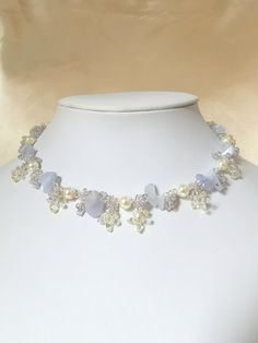 This choker-necklace is handcrafted with irregular shaped blue lace agate chips and uniform glass pearls for an elegant look. Translucent bead details dot the necklace, giving the necklace an ethereal quality. 💎Handcrafted with blue lace agate chips, glass pearls, glass seed beads, silver-plated brass, stainless steel findings and tarnish resistant copper wire. 💎All variations come with a 5cm extender Silver Necklace With Bead Caps, Adjustable Silver Necklace With Bead Caps, Crystal Necklaces With Bead Caps For Gifts, Crystal Necklaces With Bead Caps As Gift, Gift Crystal Necklaces With Bead Caps, Blue Jewlery, Ethereal Fairy, Lace Choker, Fairy Necklace