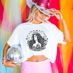 We love this fun, colorful unisex Vintage Mermaid design T-shirt! This tee is soft and super comfy and is made of 100% cotton. Heather tees are a soft cotton-poly blend. We use BELLA+CANVAS for our T-shirts! FABRICATION * Solid Colors: 100% Ringspun Cotton * Heather Colors: 52% cotton, 48% polyester * Runs true to size SIZING This style is a unisex t-shirt. If you are unsure about the size you should order, please refer to the size chart in the pictures. CARE INSTRUCTIONS * Machine wash: warm (m Short Sleeve Tops With Unicorn Print For Summer, White Custom Print T-shirt For Party, Summer Crew Neck Top With Unicorn Print, Pre-shrunk Short Sleeve T-shirt For Parties, Short Sleeve Unicorn Print Tops For Summer, Summer Short Sleeve Tops With Unicorn Print, Summer Unicorn Print Crew Neck Top, White Unicorn Print Crew Neck Top, Mermaid T Shirt Ideas