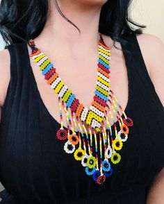 A vibrant and colorful necklace to enhance your style.🏵 Bohemian Rainbow Necklaces With Colorful Beads, Colorful Adjustable Beaded Necklaces With Polished Beads, Colorful Adjustable Beaded Necklace With Polished Beads, Summer Multicolor Beaded Necklaces With Dangling Beads, Colorful Bohemian Necklace With Round Beads, Vibrant Rainbow Jewelry With Colorful Design, Adjustable Multicolor Bib Necklace, Unique Multicolor Necklaces For The Beach, Multicolor Long Necklace For Summer