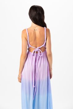 Introducing our enchanting Starlight Maxi Dress, featuring an open tie-back closure, designed to captivate attention and exude effortless charm. This stunning piece seamlessly blends elegance with a hint of allure, making it the perfect choice for any occasion. Details: 100% Rayon Hand wash cold & lay flat to dry Features: Unlined, Smocked scoop neck bodice, Thick rope straps with adjustable self tie feature, Open back detail, Ankle length maxi skirt, Dual side slits Strappy Back Maxi Dress With Back Opening For Spring, Spring Maxi Dress With Strappy Back Opening, Bohemian Party Dress With Tie Straps, Purple Maxi Dress With Spaghetti Straps For Beach, Beach Midi Sundress With Tie Back, Beach Midi Sundress With Tie-back, Purple Spaghetti Strap Beach Dress, Summer Brunch Maxi Dress With Lace-up Back, Summer Maxi Dress With Low Back And Back Opening