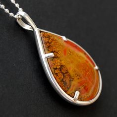 "This elegant and intricately designed necklace features a 25mm x 19mm tear drop form cut Chinese Zhanguo Warring States Red Plume Agate cabochon, a very vivid stone with vibrant and distinctive color. Beautiful plume on both sides, and you can wear reversible. Zhanguo Warring States Red Plume Agate cabochon measures in inch: 1.47\" x 1.1\" Zhanguo Warring States Red Plume Agate cabochon measures in mm: 37mm x 27mm Agate origin: China Pendant measures in inch: 1.90 inch long and 1.14 inch wide a Plume Agate, Rapid City, Agate Cabochon, Agate Jewelry, Agate Necklace, Money Clip Wallet, Silver Coins, Gold Plated Chains, Jewelry Diy