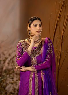 Introducing our stunning Purple Organza Outfit! This elegant dress is adorned with intricate details, featuring beautiful embroidery and embellishments. The rich purple color adds a regal touch, and it comes with a chooridar pajama for a complete look. Perfect for making a statement at special occasions! Purple Silk Sharara For Navratri, Purple Anarkali Set With Straight Kurta And Dabka Work, Purple Chanderi Sharara For Navratri, Semi-stitched Purple Sharara With Resham Embroidery, Bollywood Purple Raw Silk Sharara, Bollywood Style Purple Raw Silk Sharara, Purple Bollywood Raw Silk Sharara, Navratri Purple Sharara With Straight Kurta, Designer Art Silk Purple Kurta