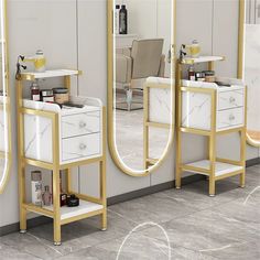 three white and gold vanity tables with mirrors on the wall next to each other in front of a mirror