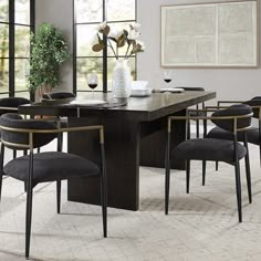 a dining room table with chairs around it