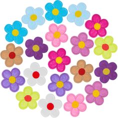 colorful felt flowers arranged in a circle on a white background