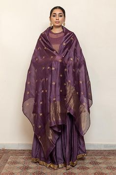 Aubergine kurta with embroidered floral and half moon motifs. Comes with an inner, matching gharara and chanderi silk dupatta.
Components: 4
Pattern: Embroidered
Type Of Work: Thread, Sequin
Neckline: Round
Sleeve Type: Three quarter
Fabric: Kurta: Chanderi Tissue, Gharara: Cotton Silk, Dupatta: Chanderi Silk, Lining: Cotton
Color: Purple
Other Details: 
Straight silhouette
Kurta side gathers
Occasion: Sangeet,Mehendi and Haldi - Aza Fashions Types Of Work, Silk Dupatta, Kurta Set, Half Moon, Cotton Silk, Aza Fashion, Sleeve Type, Three Quarter, Color Purple