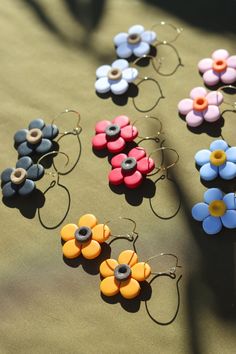 Daisy earrings are surprisingly light weight flower earrings come in various colors. Made from lightweight polymer clay. 18k gold plated ball posts and hoops. Slow-made by hand in Scarborough, Maine. Scarborough Maine, Daisy Earrings, Rubbing Alcohol, Brass Jewelry, Flower Earrings, Washer Necklace, Polymer Clay, Maine, Daisy