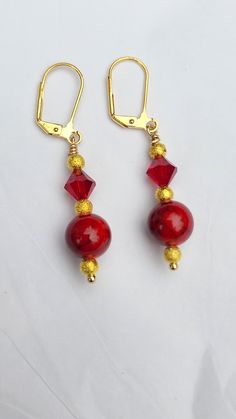 Beautiful gold-plated earrings made with bright red glass crystal beads. Nickel free Red Faceted Beads Jewelry For Christmas, Elegant Holiday Jewelry With Matching Earrings, Red Faceted Beads Earrings For Festive Occasions, Holiday Red Beaded Earrings With Ear Wire, Red Dangle Jewelry For Christmas, Elegant Nickel-free Jewelry For Holiday, Gold Beaded Earrings With Faceted Beads For Gifts, Elegant Red Czech Glass Earrings, Red Dangle Earrings With Ear Wire