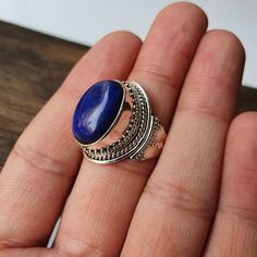 Natural Lapis Lazuli ring, Real Sterling Silver ring, cocktail ring, alternative engagement ring, avant garde, birthstone ring, Lapis Lazuli jewellery Description: Be assured that the product you order is MADE JUST FOR YOU and is not a mass produced item. The gemstone is a OVAL shaped LAPIS LAZULI GEMSTONE SIZE- 18*13 mm. You have an option to choose a gem for yourself from a set of the stones. Please ask. The rest of the ring is made from 925 STERLING SILVER i.e 92.5% pure silver. And it DOESN' Bohemian Oval Jewelry For Wedding, Bohemian Oval Wedding Jewelry, Bohemian Open Ring Jewelry Gift, Unique Oval Rings For Jewelry Making, Handmade Sapphire Promise Ring, Unique Oval Rings As Gift, Bohemian Metal Ring Jewelry For Anniversary, Unique Oval Ring For Gift, Artisan Oval Ring For Gift