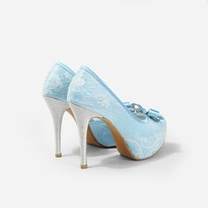 Lady Bella is a pair of custom made shoes in sweet baby blue satin. This pair of wedding heels features silky satin fabric with ivory white lace overlay. The front of this bridal heel features a dainty bow and the 4.5 inch heel of this bridal shoe is finished in silver glitter fabric. This pair of shoes is made using satin, glitter, lace, PU and other synthetic materials. They can be customized in different heel heights, colors and styles. They come with 0.5 inch elevated platform front. CUSTOMI Satin Closed-toe Wedding Shoes, Closed Toe Satin Heels For Wedding, Satin Closed Toe Heels For Wedding, Satin Closed Toe Wedding Shoes, High Heel Satin Wedding Shoes, Satin High Heel Wedding Shoes, Light Blue Round Toe Evening Wedding Shoes, Elegant Light Blue Wedding Shoes For Formal Occasion, Light Blue High Heel Wedding Heels