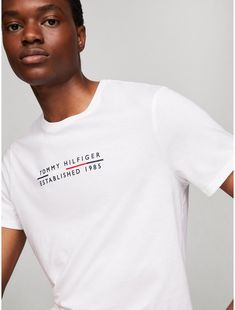 Tommy Hilfiger men's T-shirt. Made from lightweight cotton jersey, known for its breathability and stretch, our comfortable crewneck tee is cut in an easy fit and finished with our embroidered logo.  Material: 100% Cotton. White Cotton Tommy Hilfiger T-shirt, Tommy Hilfiger White T-shirt With Graphic Print, Tommy Hilfiger Sporty T-shirt With Graphic Print, Tommy Hilfiger Sporty Graphic Print T-shirt, Tommy Hilfiger Relaxed Fit T-shirt With Graphic Print, Tommy Hilfiger Crew Neck T-shirt With Logo, Tommy Hilfiger Logo Print Crew Neck T-shirt, Tommy Hilfiger Cotton T-shirt With Text Print, Tommy Hilfiger Cotton T-shirt With Letter Print