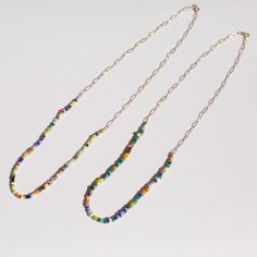 Quirky, modern, and super cool. African glass beads on a 14k Gold Open Link Chain. Available in 14k yellow gold. Made in the USA All CH jewelry is made to order. Please allow up to 10 business days for your item(s) to ship. Yellow Gold Beaded Necklaces With Colorful Beads, Multicolor Round Beads 14k Gold Filled Jewelry, Multicolor 14k Gold Filled Round Bead Jewelry, Multicolor 14k Gold-filled Round Beaded Jewelry, Gold Czech Glass Beaded Chain Necklaces, 14k Gold Filled Multicolor Round Beads Jewelry, Gold Czech Glass Necklaces With Beaded Chain, Gold Czech Glass Beaded Chain Necklace, Modern Jewelry With Colorful Beads