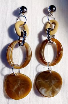 These are unique Chunky Acrylic Chain design handmade originals  These are very light and all ACRYLIC   Fabulous and sturdy gold rhinestone clip on closure They hang 4.5 inches  These are very lightweight on the ear Easy to wear They are one of a kind These Earrings are a classic and modern addition to any  wardrobe Modern Brown Jewelry For Parties, Chic Brown Dangle Jewelry, Trendy Brown Earrings, Chic Brown Metal Jewelry, Brown Metal Chain Jewelry, Chic Brown Round Jewelry, Chic Brown Handmade Jewelry, Trendy Brown Party Earrings, Trendy Brown Earrings For Party