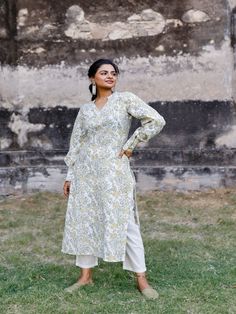 White & Mustard Floral Hand Block Printed Pant Kurta Set (Set of 2) by Pheeta now available at Trendroots Eid Floral Print Tunic Kurta, Floral Print Long Sleeve Palazzo Set For Navratri, Floral Print Straight Kurta For Navratri, Cotton Floral Print Kurta For Navratri, Traditional Long Sleeve Palazzo Set For Spring, Eid Floral Print Kurta, Long Sleeve Kalamkari Print Sets For Spring, Spring Kalamkari Print Long Sleeve Sets, Straight Kurta With Set-in Sleeves For Spring