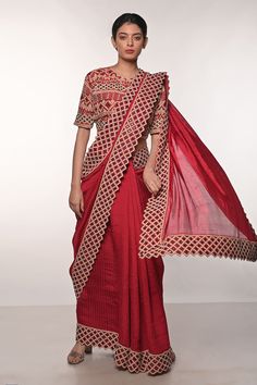 Red handloom silk saree with block print and gujrati sindhi thread and mirror hand embroidered borders. Comes with blouse and a belt.
Components: 2
Pattern: Block printed, Hand embroidered
Type Of Work: Thread, Mirror
Neckline: Round
Sleeve Type: Half
Fabric: Handloom silk
Color: Red
Other Details: 
Heavily embroidered blouse
Occasion: Sangeet - Aza Fashions Handloom Silk Saree, Embroidered Saree, Red Saree, Blouse For Women, Fashion App, Saree With Blouse, Blouse Online, Printed Sarees, Red Blouses